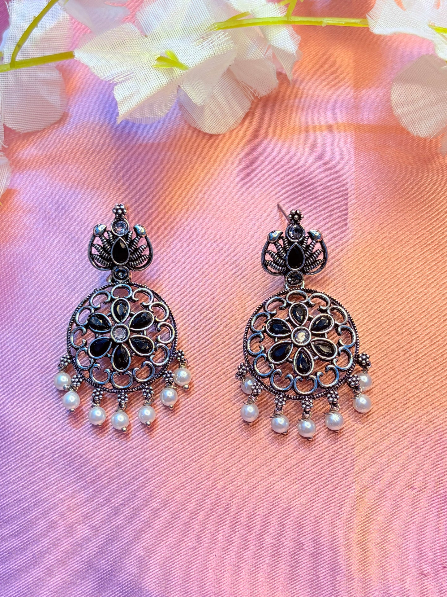 Black ornate earrings with pearl