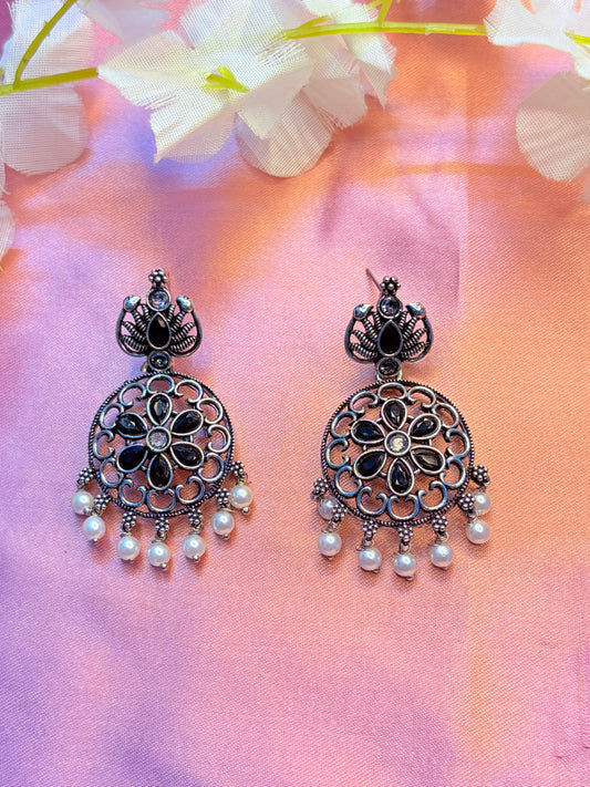 Black ornate earrings with pearl